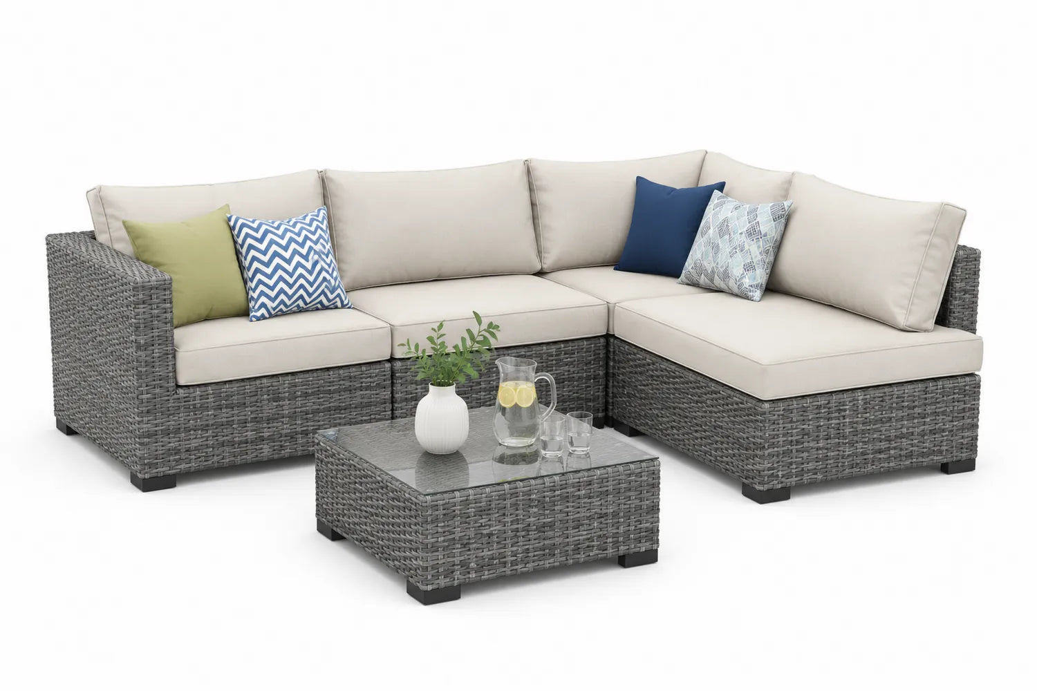 Set divano angolare da esterno in rattan con cuscini e tavolino in vetro